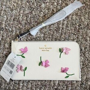 Kate Spade Cream Wristlet with Pink Floral Design